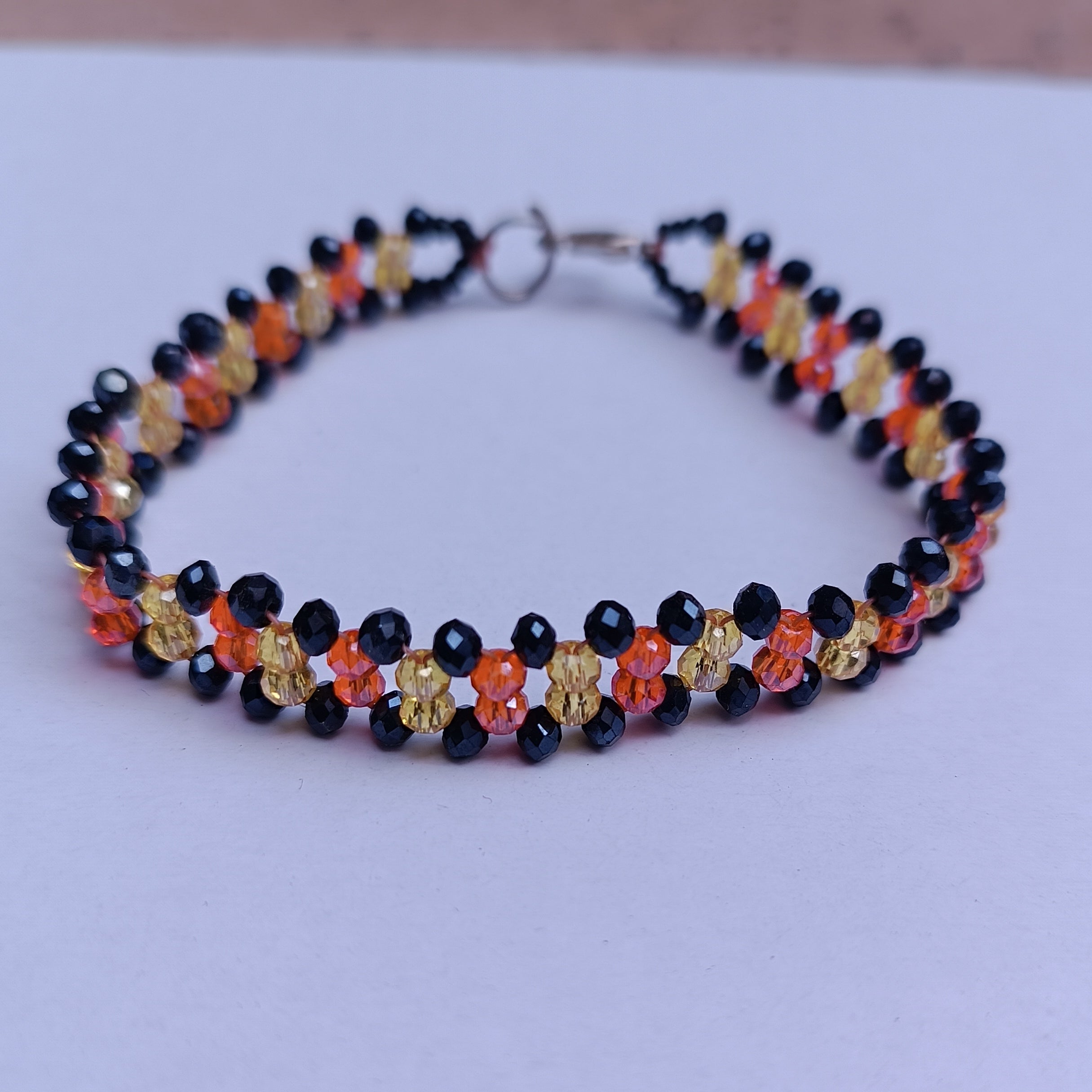 Handmade Crystal Beaded Bracelet – Black, Orange & Yellow